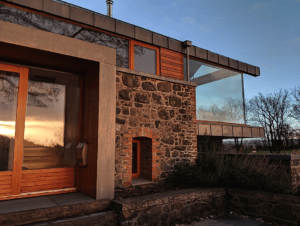The late evening winter sun really makes the red wood and stunning glazing of the Copper Barn glow