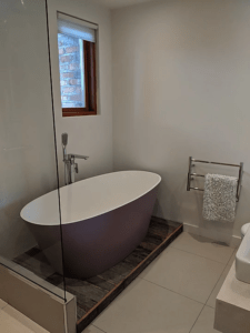 Even the bath was made in Northern Ireland, with the dusky purple sided free-standing bath and taps made by local company Adamsez